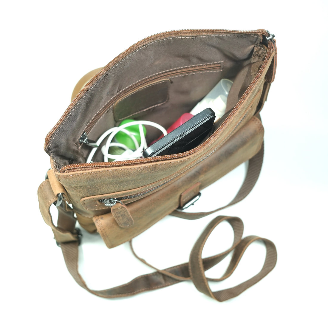 Sandel leather messenger bag with zippers and buckles on a white background