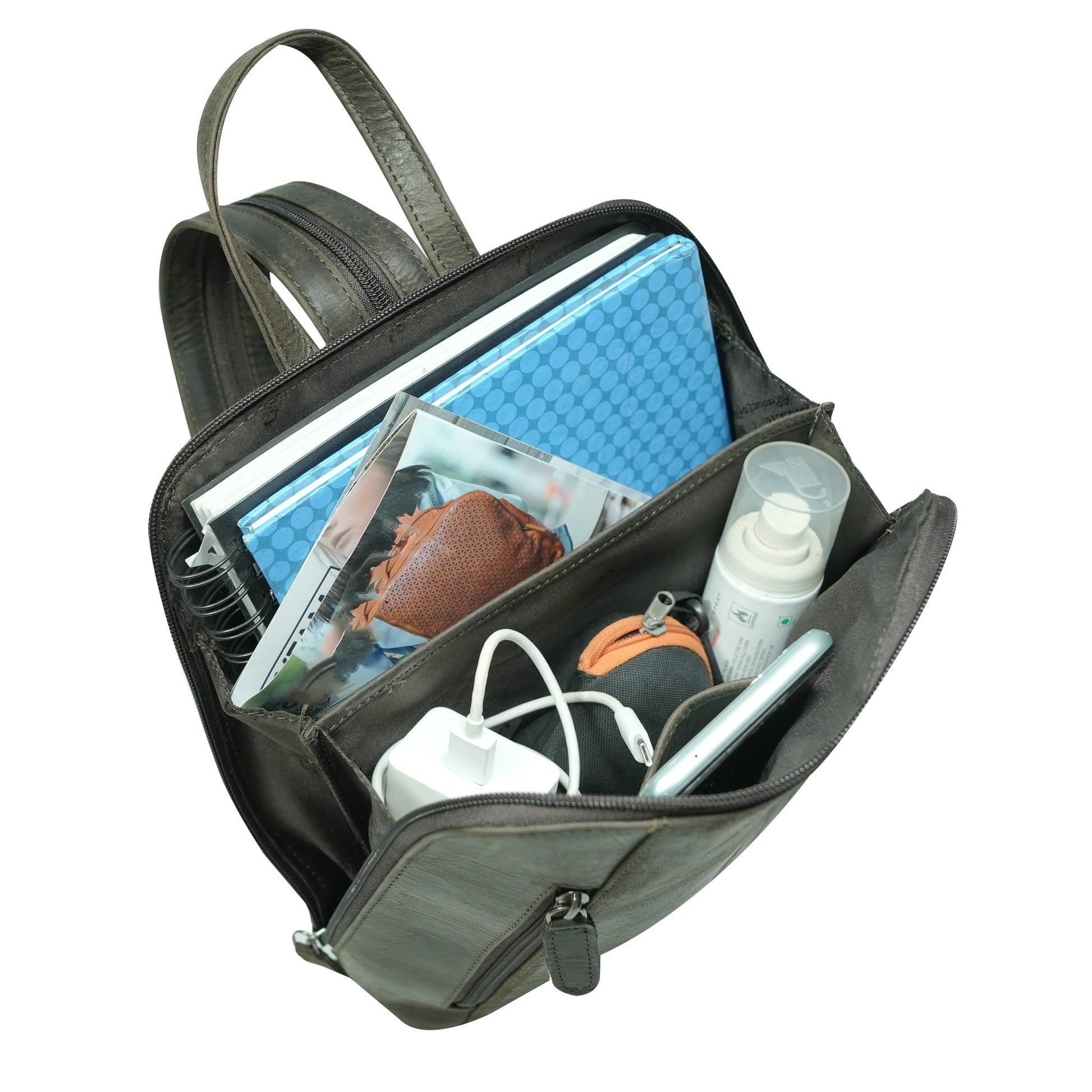 Brown backpack with compartments containing items like a bottle, charger, and books.